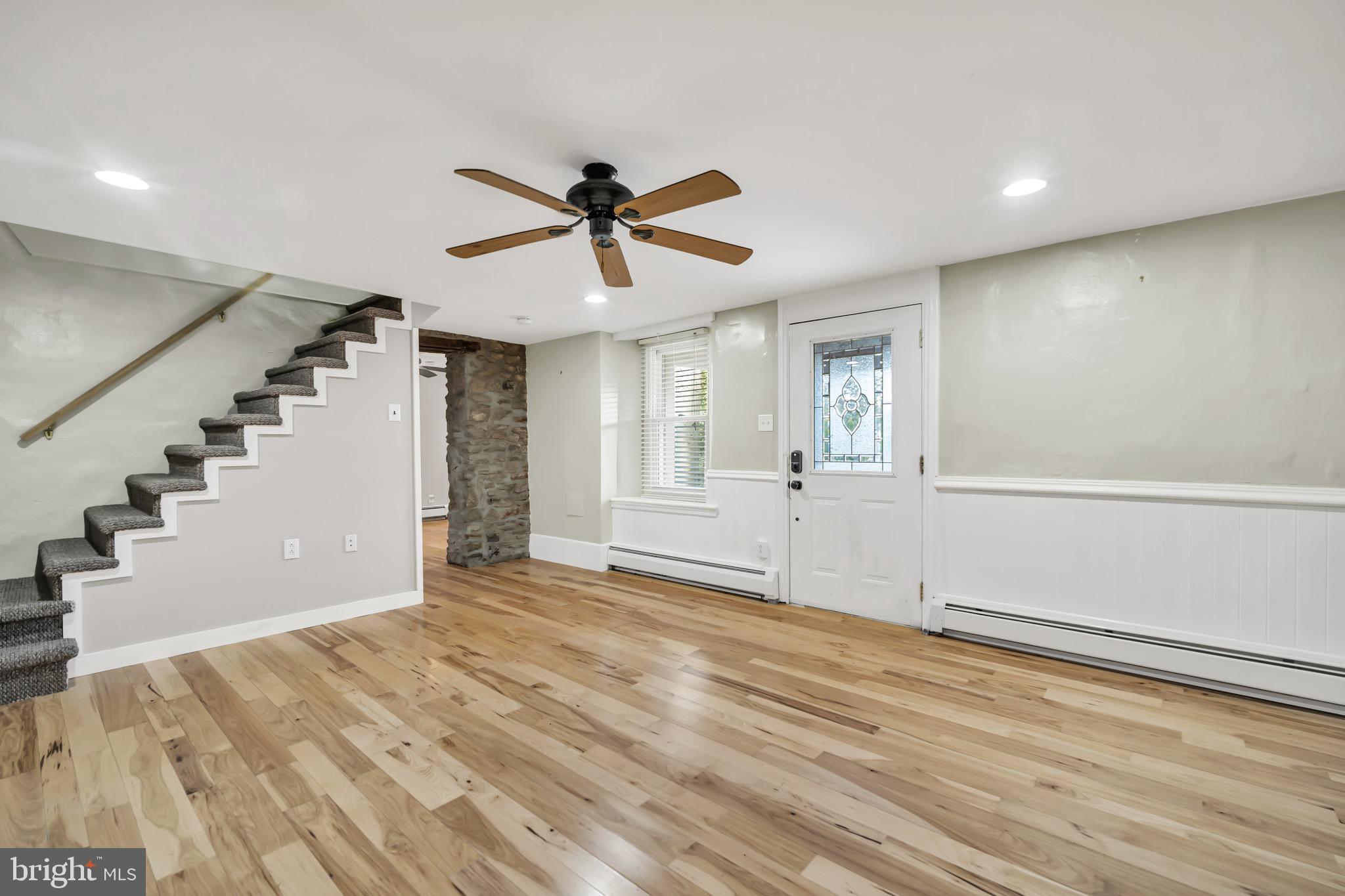 246 Cottage Avenue, Unit A Horsham, PA 19044 - Photo 4 of 21 a view of a big room with wooden floor and windows
