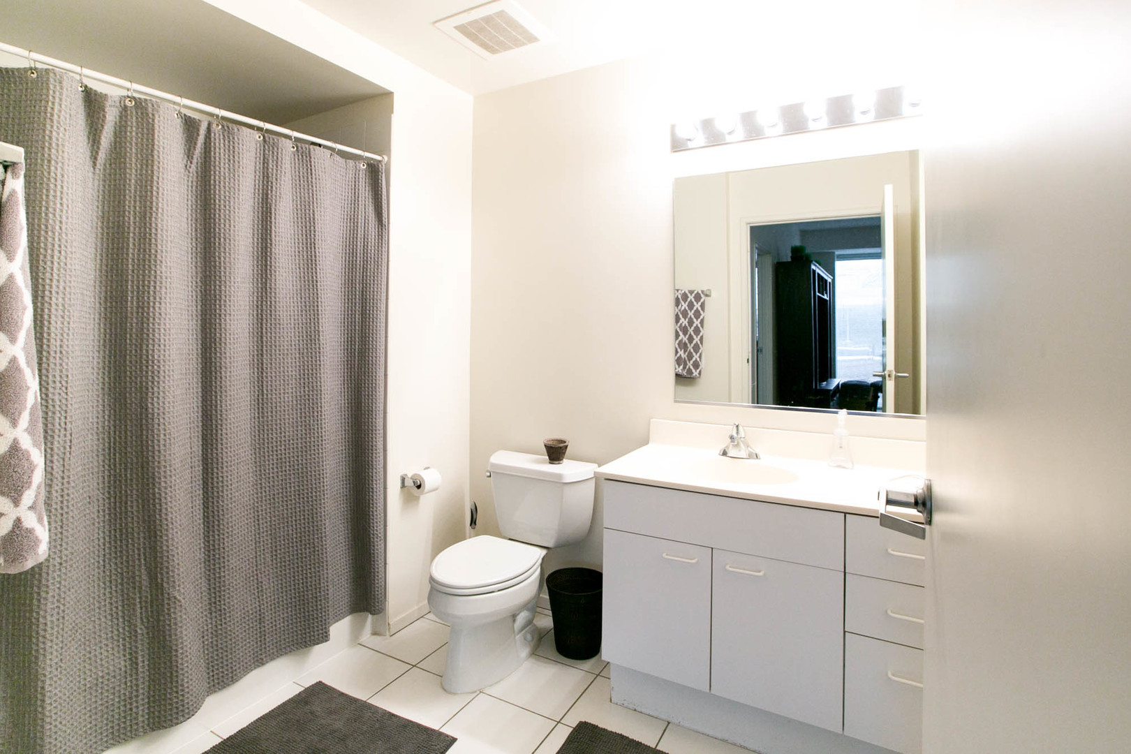 1720 Maple Avenue, Unit 407 Evanston, IL 60201 - Photo 10 of 16 a bathroom with a toilet sink and mirror