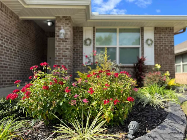 a flower is in front of a house