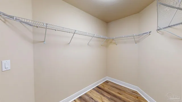 a bathroom with a tub double sink and mirror