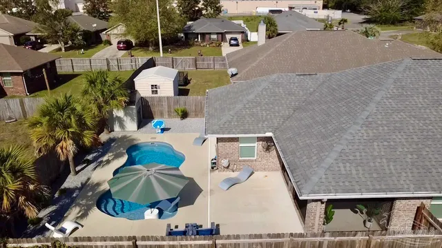 an aerial view of a house having yard