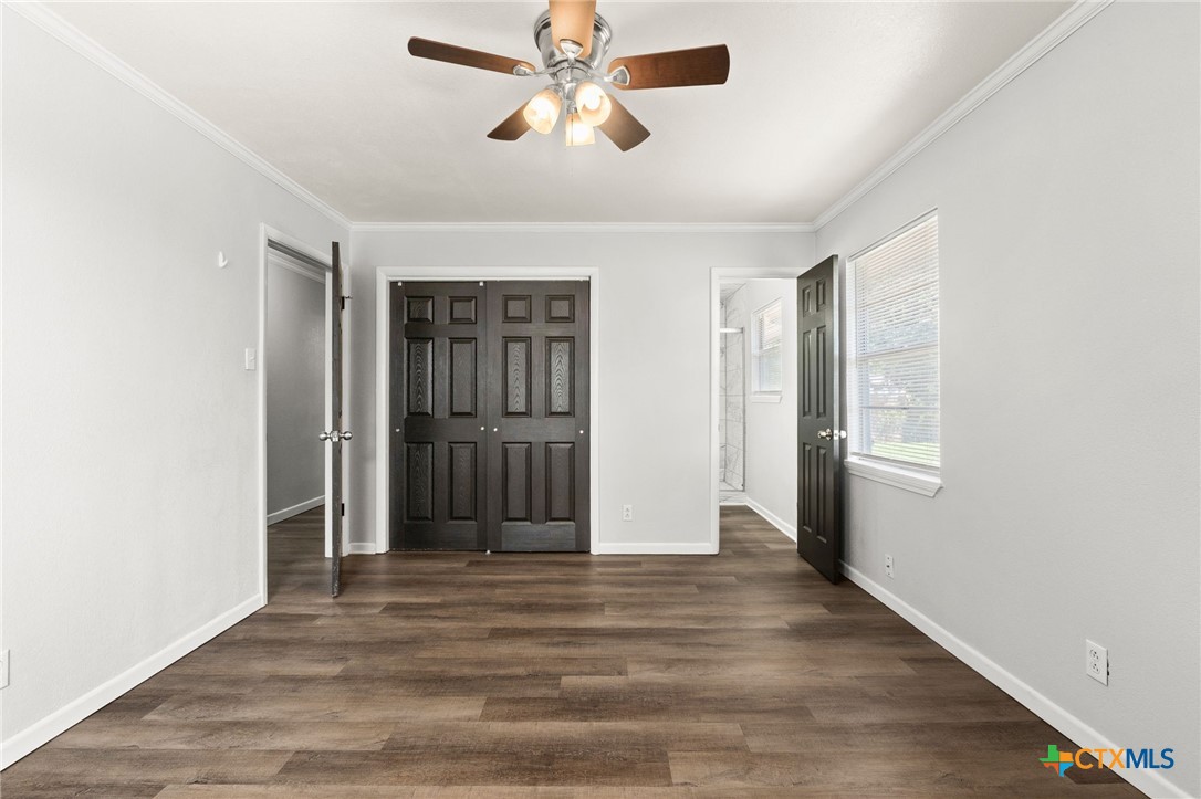 1401 Stephen Street Killeen, TX 76549 - Photo 14 of 27 a view of empty room with wooden floor and ceiling fan