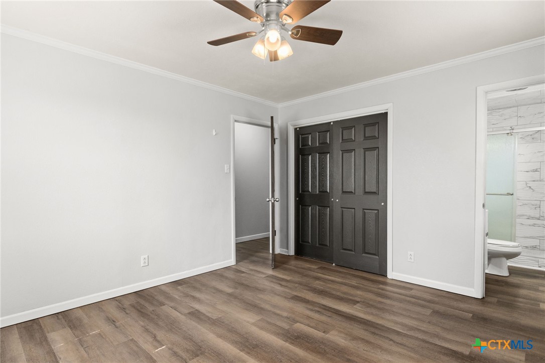 1401 Stephen Street Killeen, TX 76549 - Photo 15 of 27 a view of a room with wooden floor and ceiling fan