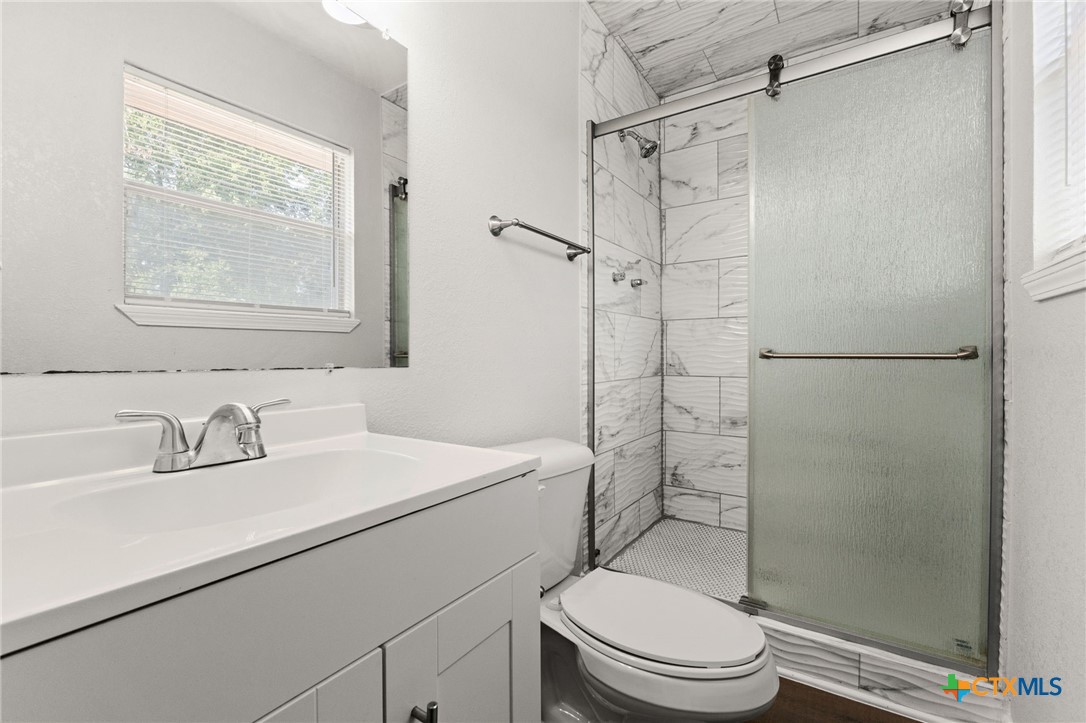 1401 Stephen Street Killeen, TX 76549 - Photo 16 of 27 a bathroom with a sink toilet and shower