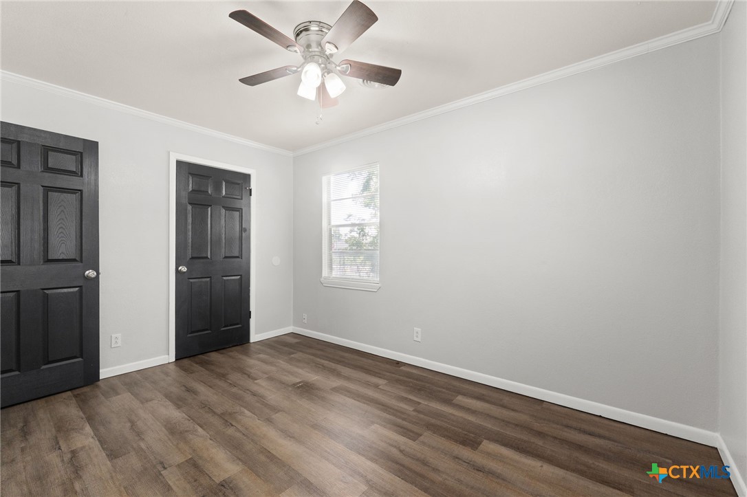 1401 Stephen Street Killeen, TX 76549 - Photo 19 of 27 wooden floor in an empty room with a window