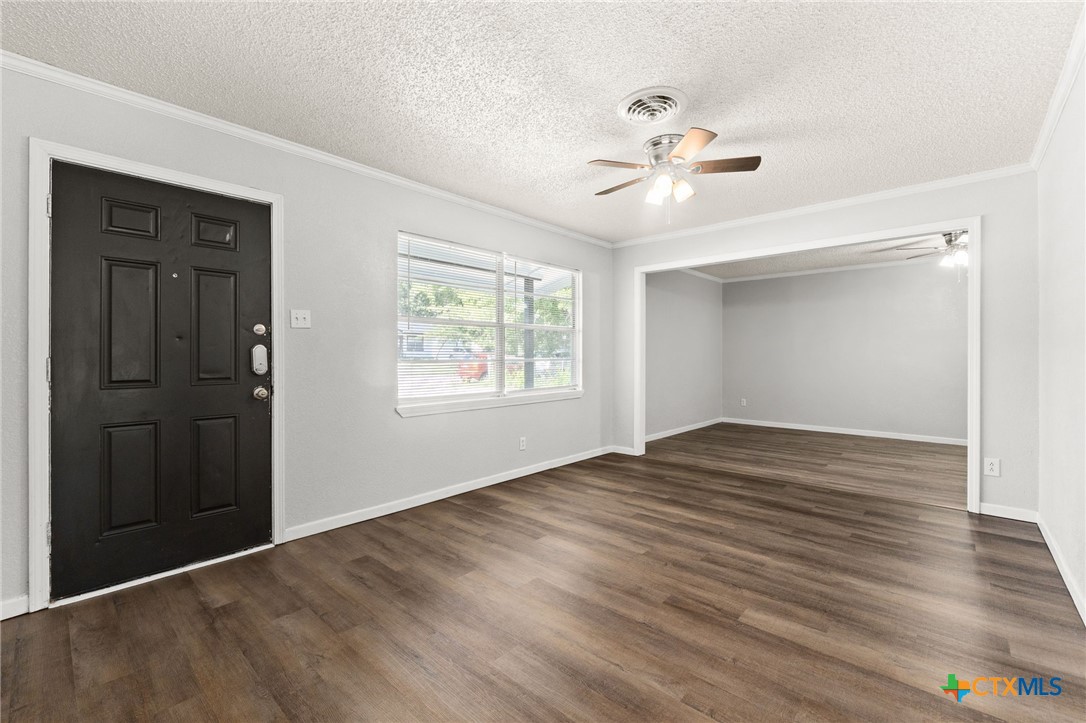 1401 Stephen Street Killeen, TX 76549 - Photo 4 of 27 wooden floor in an empty room with a window