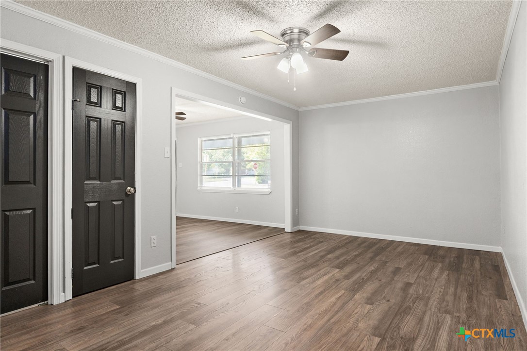 1401 Stephen Street Killeen, TX 76549 - Photo 7 of 27 wooden floor in an empty room with a window