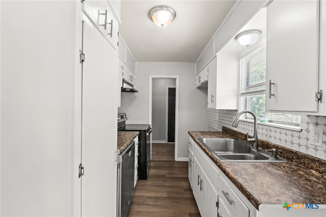 1401 Stephen Street Killeen, TX 76549 - Photo 9 of 27 a kitchen with stainless steel appliances granite countertop a sink stove and refrigerator