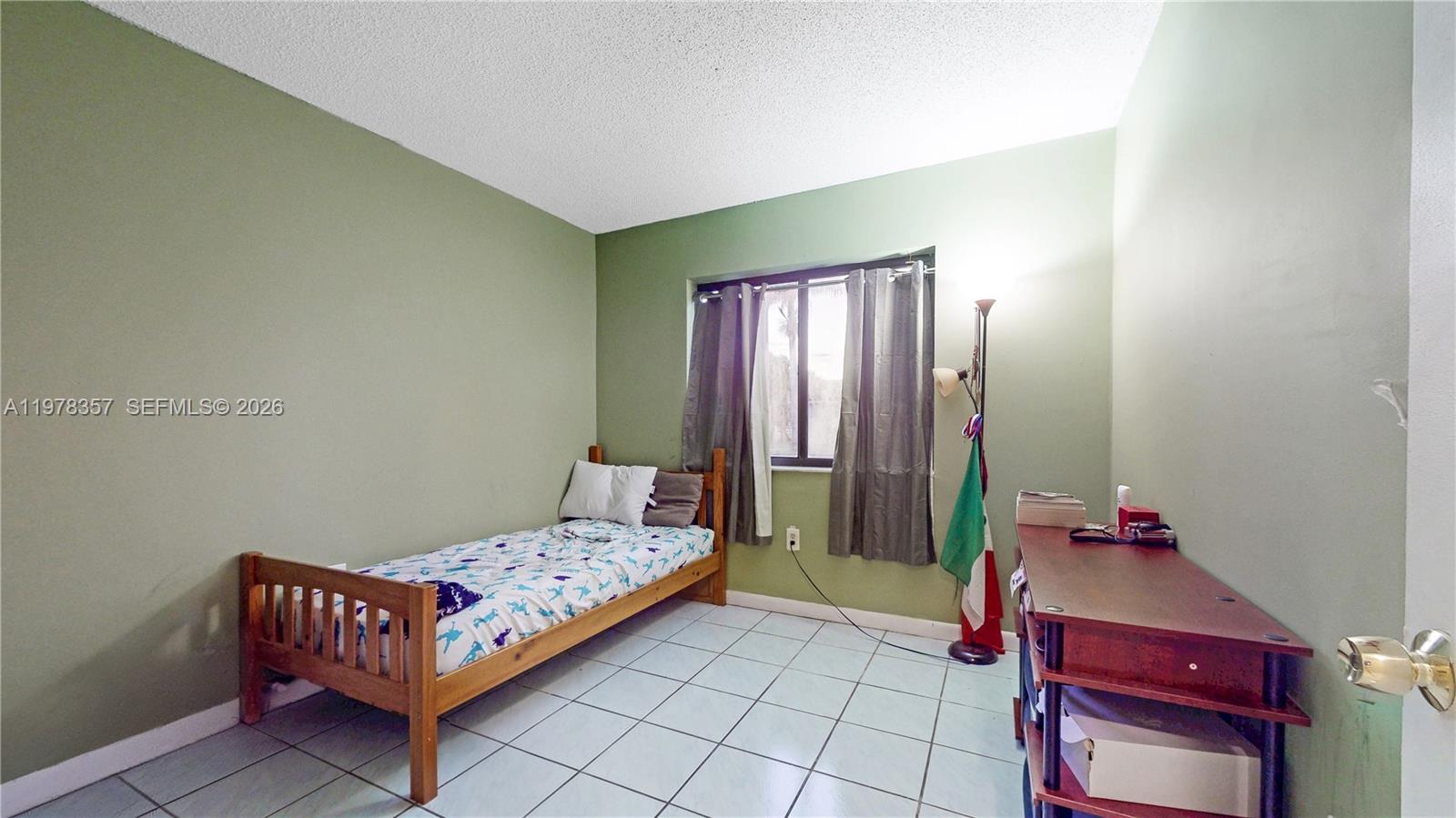 15255 Southwest 99th Court Miami, FL 33157 - Photo 12 of 18 a bedroom with a bed and wooden floor