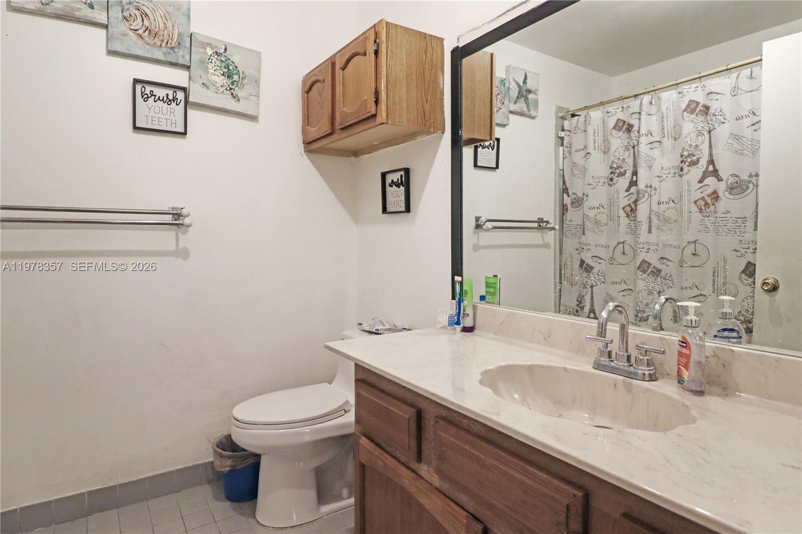 15255 Southwest 99th Court Miami, FL 33157 - Photo 13 of 18 a bathroom with a granite countertop sink toilet and shower