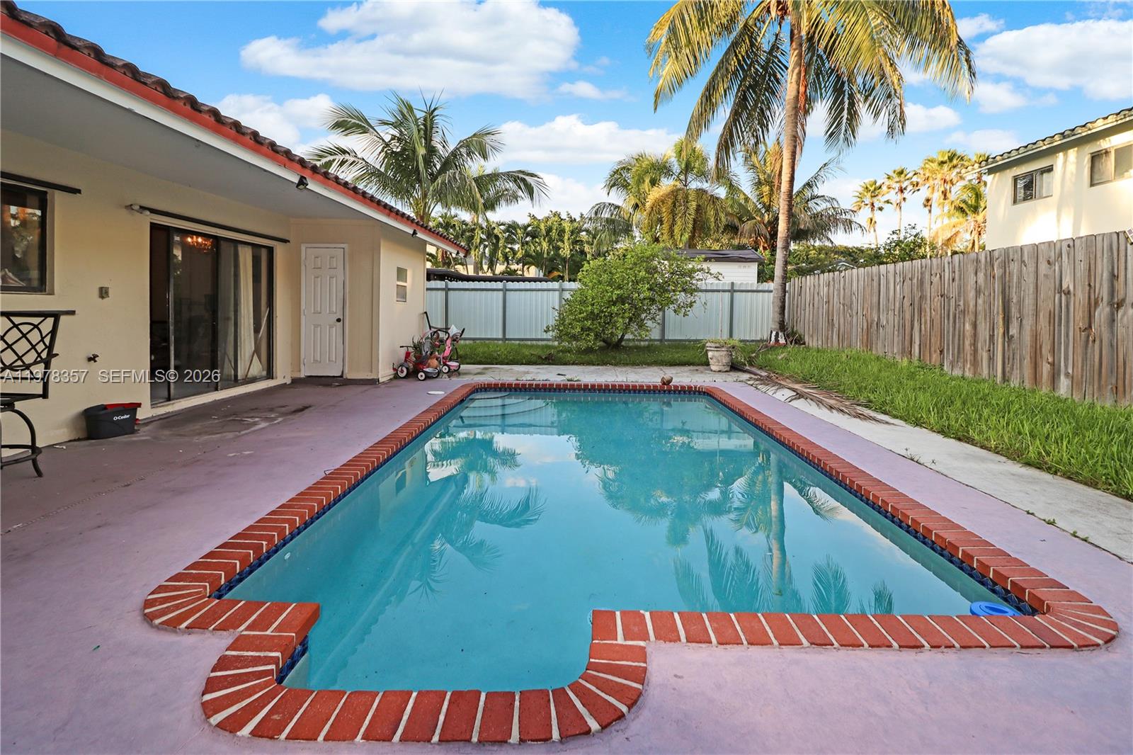 15255 Southwest 99th Court Miami, FL 33157 - Photo 2 of 18 a view of a backyard with swimming pool