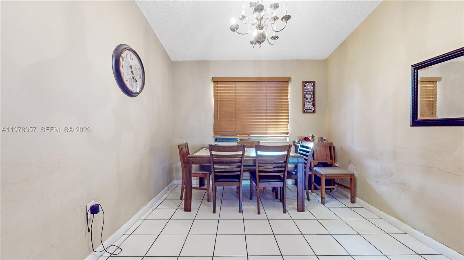 15255 Southwest 99th Court Miami, FL 33157 - Photo 7 of 18 a dining room with furniture and chandelier