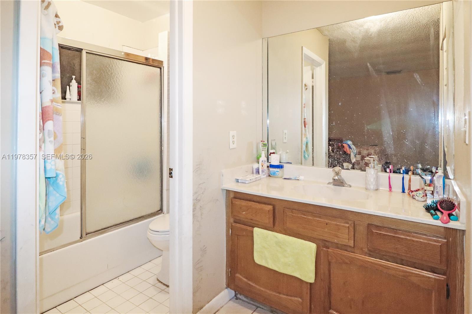 15255 Southwest 99th Court Miami, FL 33157 - Photo 9 of 18 a bathroom with a sink and a mirror