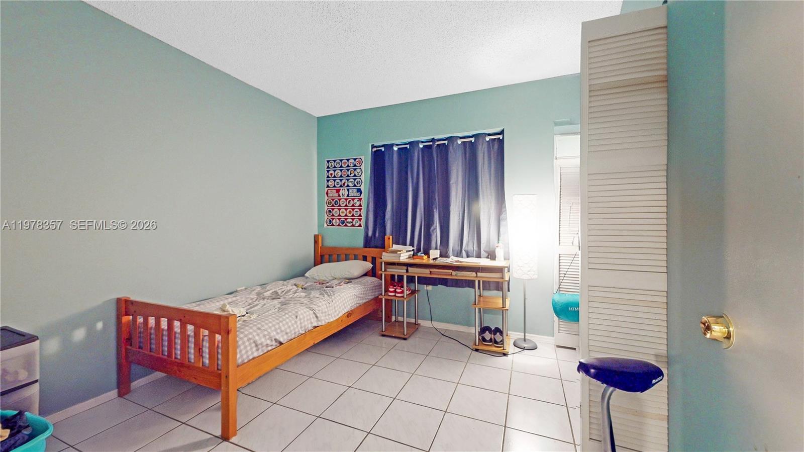 15255 Southwest 99th Court Miami, FL 33157 - Photo 10 of 18 a bedroom with furniture and a window