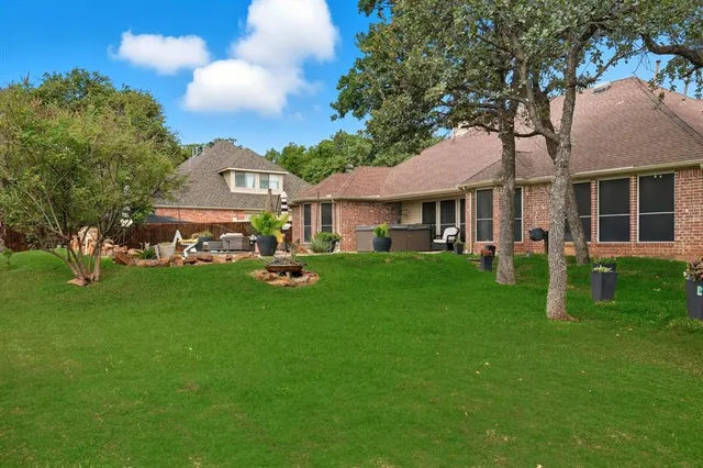a view of a house with a backyard porch and sitting area