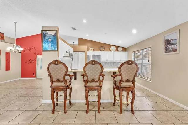 a view of dining room and hall with wooden furniture