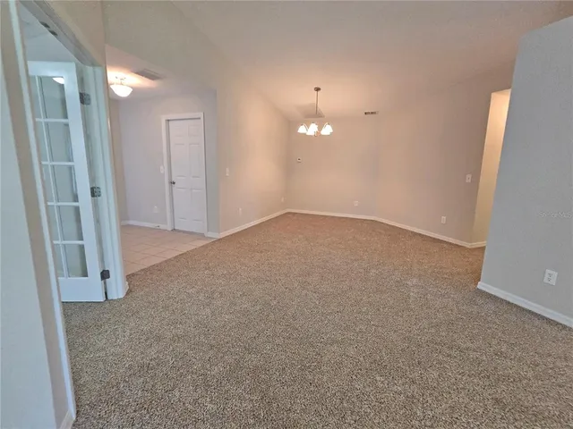 an empty room with a mirror