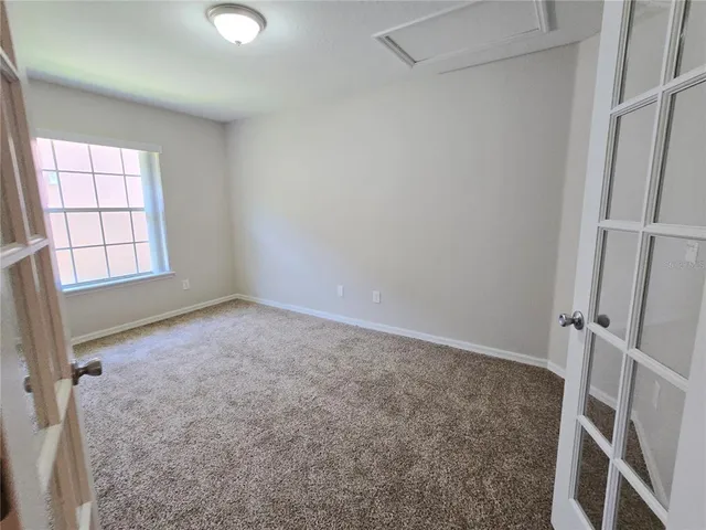 an empty room with windows