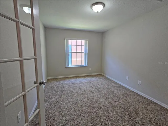 a view of empty room with windows