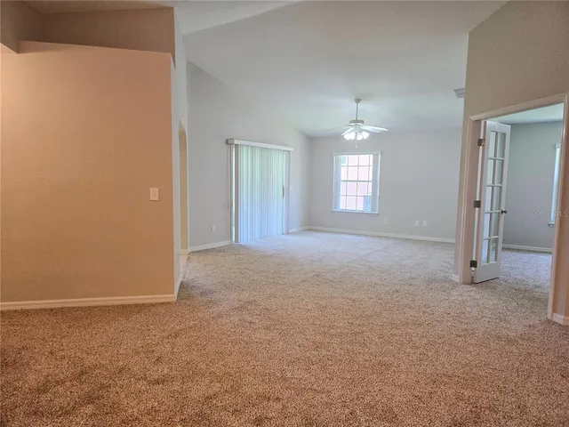 an empty room that has a window in it