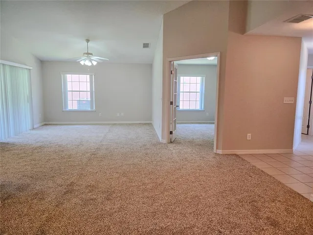 an empty room that has a window in it