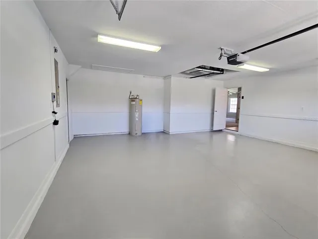 a view of a livingroom with a ceiling fan and window