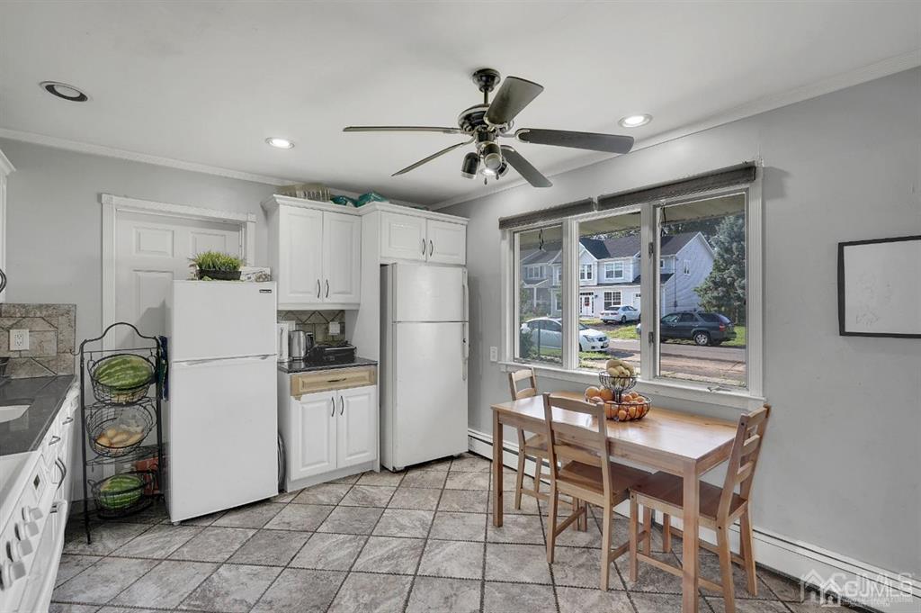 141 Winthrop Road Edison, NJ 08817 - Photo 11 of 30 a kitchen with refrigerator and cabinets