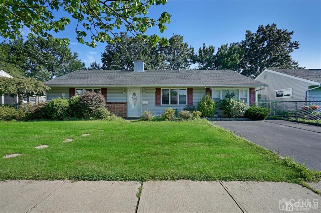 141 Winthrop Road Edison, NJ 08817 - Photo 4 of 30 a front view of a house with a garden