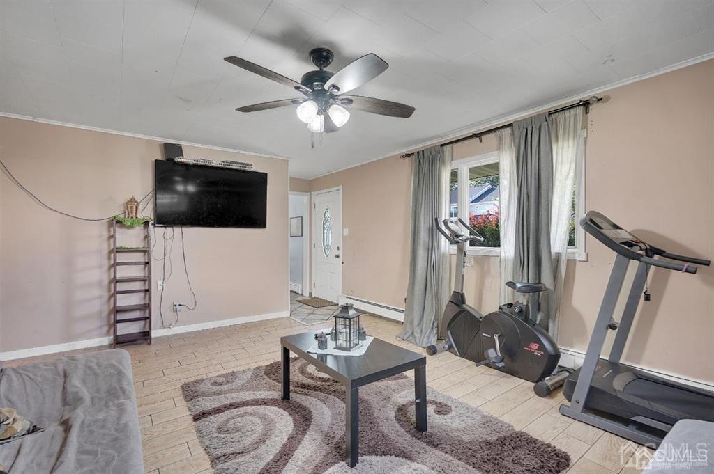 141 Winthrop Road Edison, NJ 08817 - Photo 8 of 30 a living room with furniture and a flat screen tv
