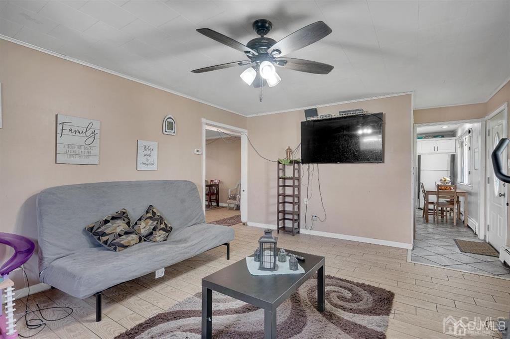 141 Winthrop Road Edison, NJ 08817 - Photo 9 of 30 a living room with furniture and a flat screen tv