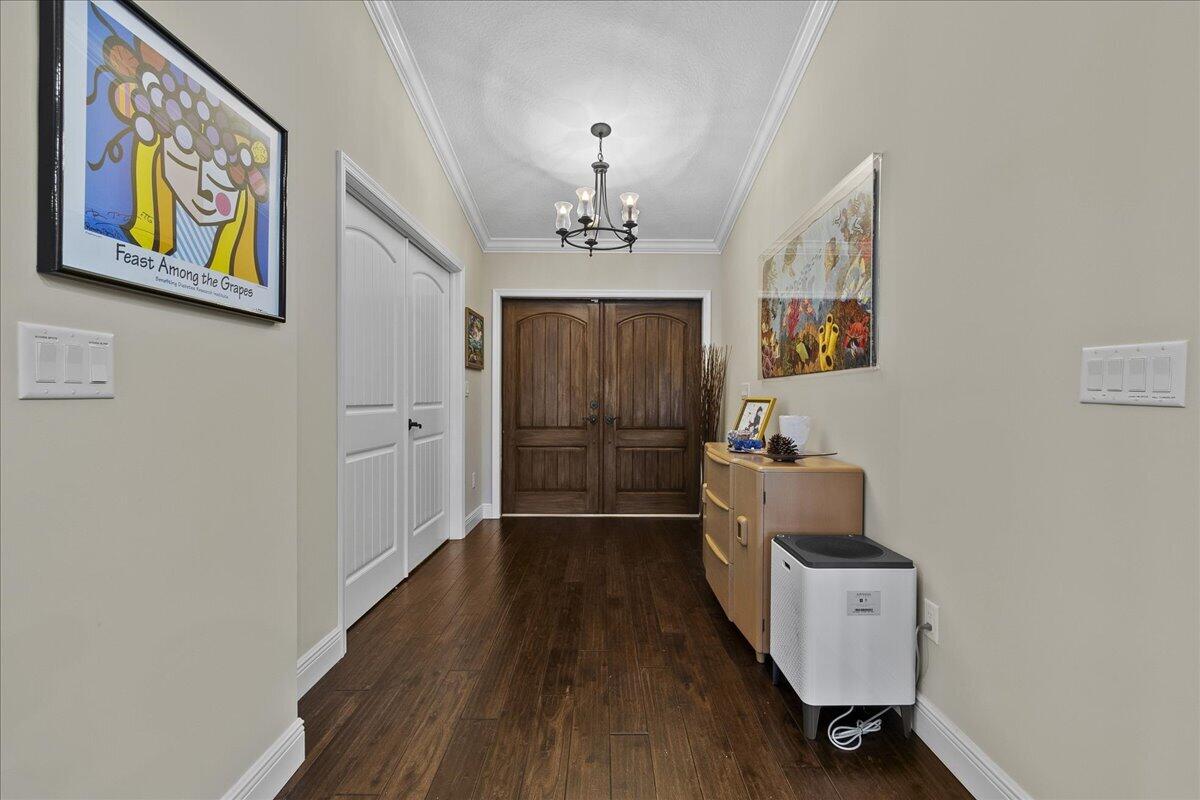 10975 Randolph Siding Road Jupiter, FL 33478 - Photo 16 of 97 a view of room with furniture and wooden floor