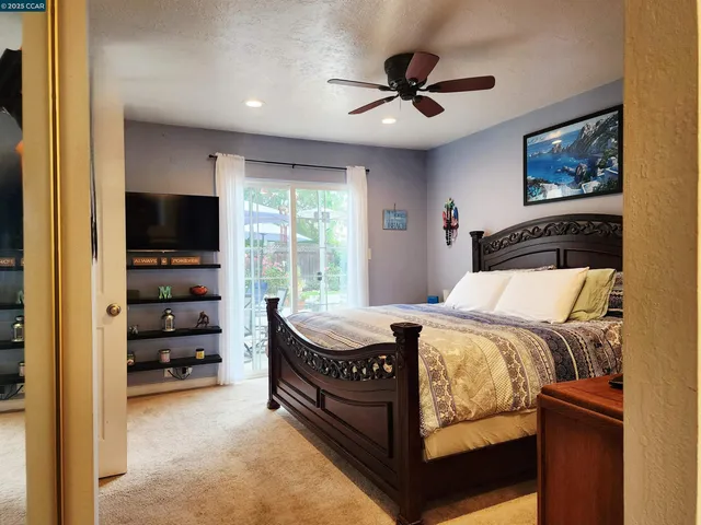 a bedroom with a bed and furniture