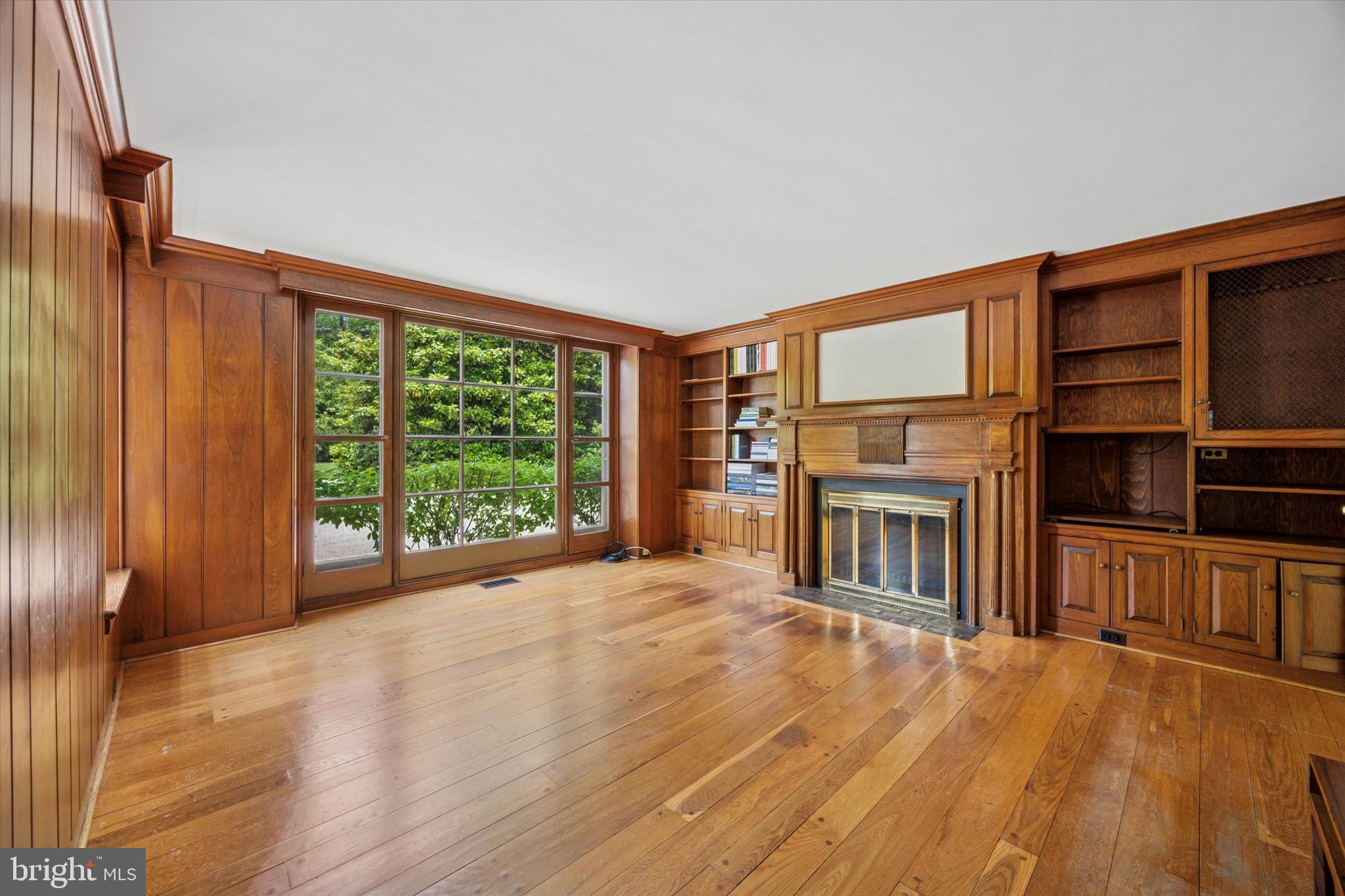 1024 North Spring Mill Road Villanova, PA 19085 - Photo 14 of 34 a view of a livingroom with furniture hardwood floor and a fireplace