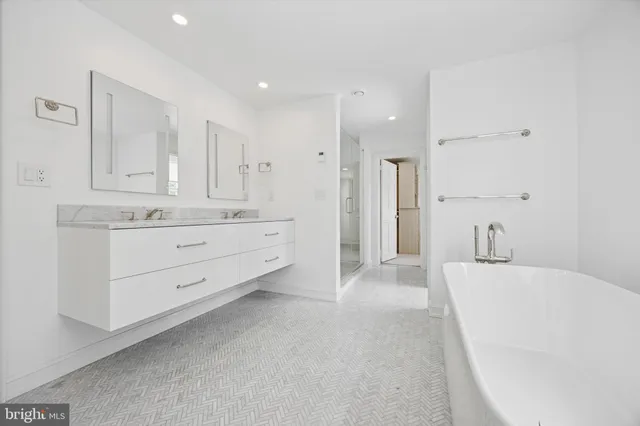 a view of a kitchen with white cabinets