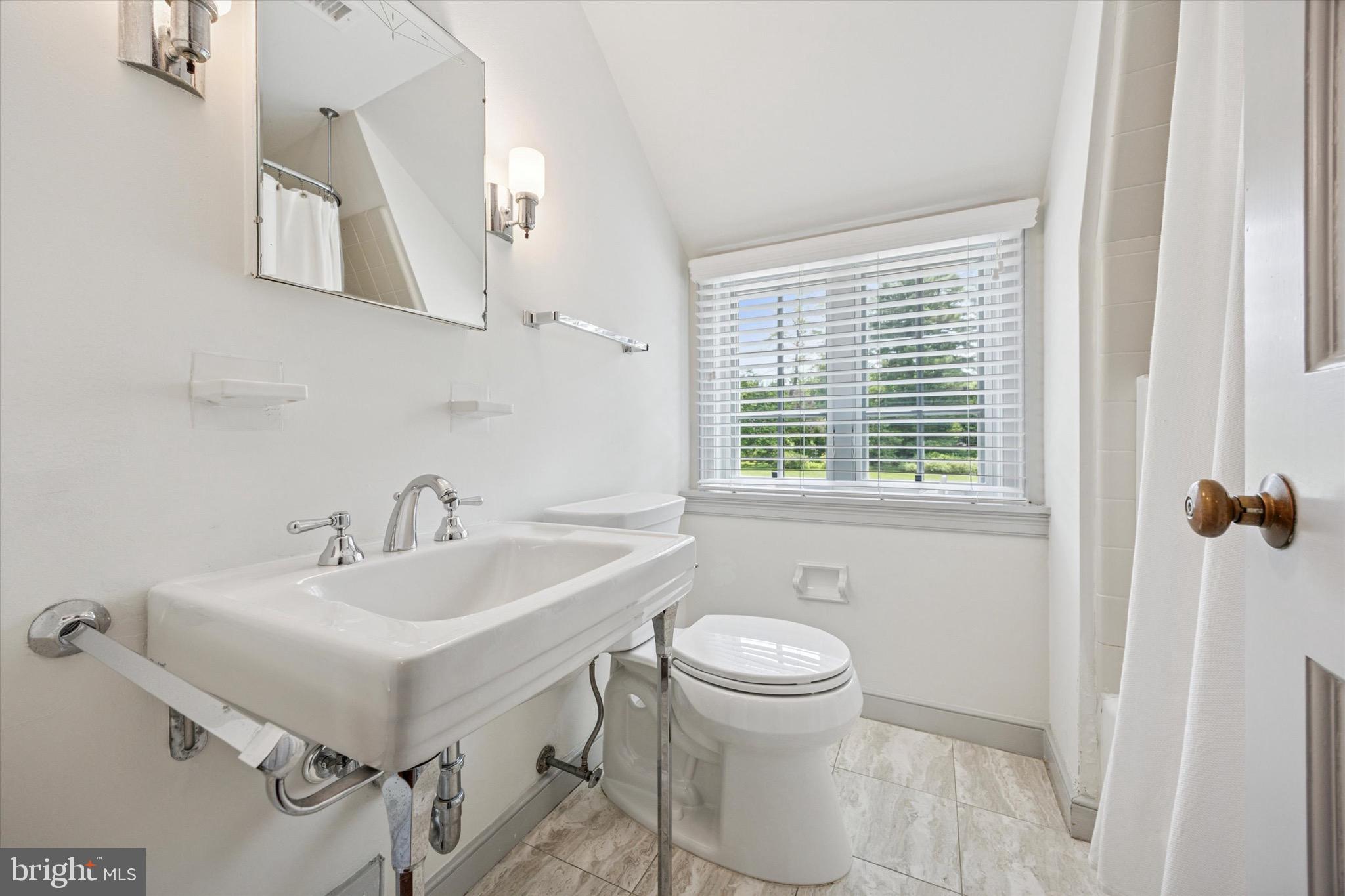 1024 North Spring Mill Road Villanova, PA 19085 - Photo 25 of 34 a bathroom with a sink toilet and mirror
