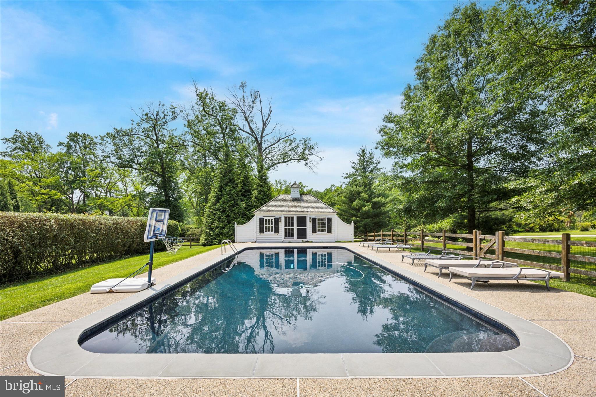 1024 North Spring Mill Road Villanova, PA 19085 - Photo 26 of 34 a view of a swimming pool with a back yard
