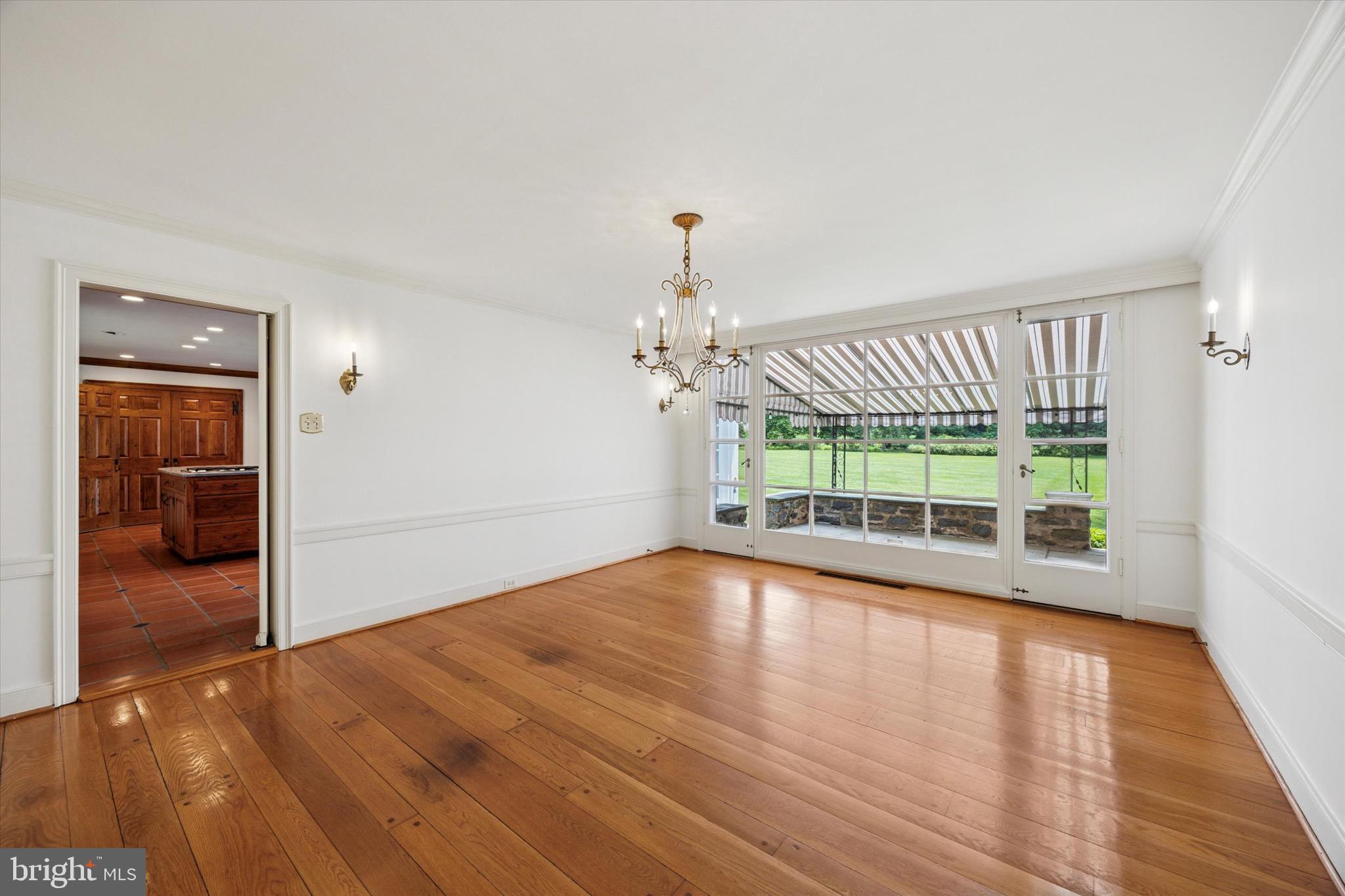1024 North Spring Mill Road Villanova, PA 19085 - Photo 7 of 34 wooden floor in an empty room with a window