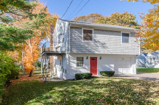 15 Kabeyun Road Marion, MA 02738 - Photo 3 of 18 a front view of a house with a yard