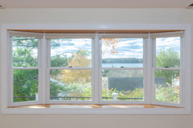 15 Kabeyun Road Marion, MA 02738 - Photo 4 of 18 a view of a lake and a yard from a window