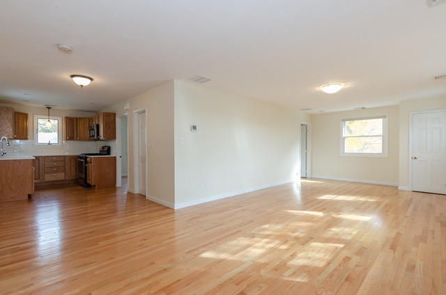 15 Kabeyun Road Marion, MA 02738 - Photo 6 of 18 a view of an empty room with window and wooden floor