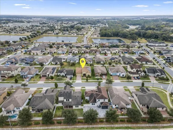 an aerial view of residential houses with outdoor space