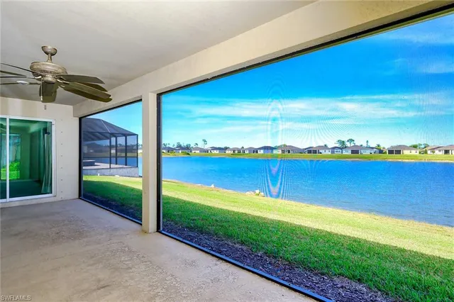 a view of an ocean with a floor to ceiling window and an ocean view