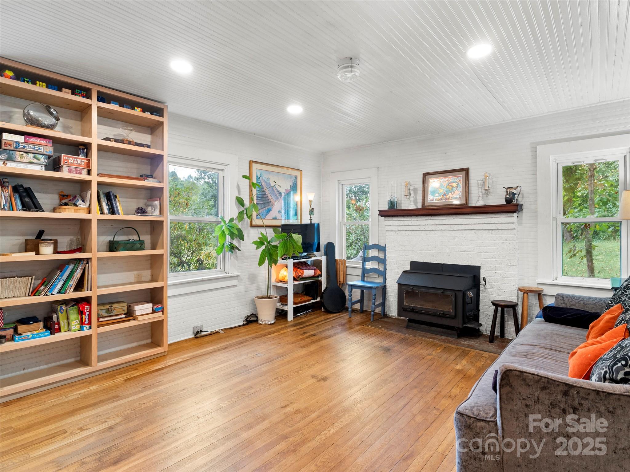 27 Barkn Cove Canton, NC 28716 - Photo 14 of 32 a living room with furniture and a fireplace