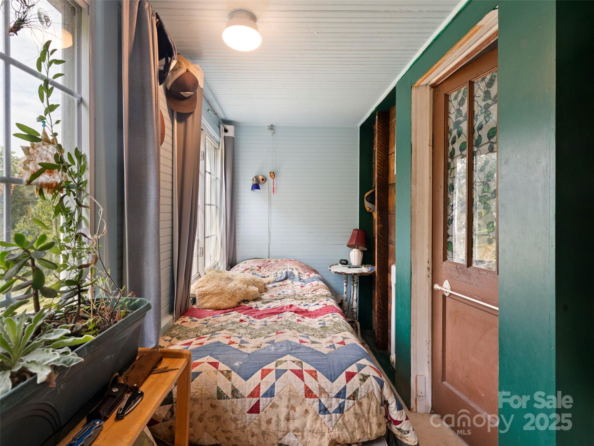 27 Barkn Cove Canton, NC 28716 - Photo 21 of 32 a bedroom with a bed and a window
