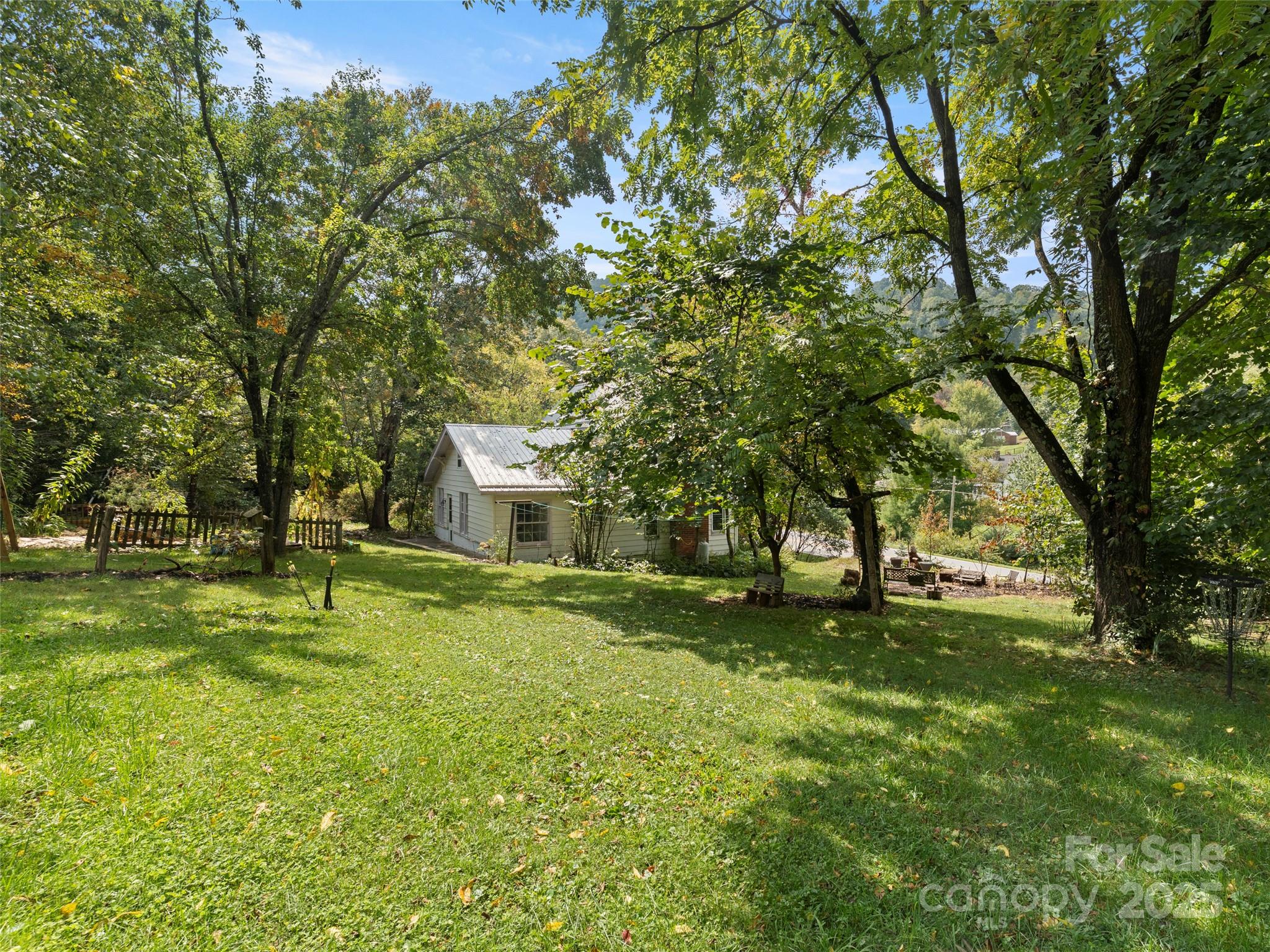 27 Barkn Cove Canton, NC 28716 - Photo 26 of 32 a house with a big yard and large trees