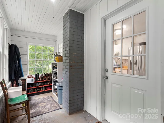 a room with furniture and a large window