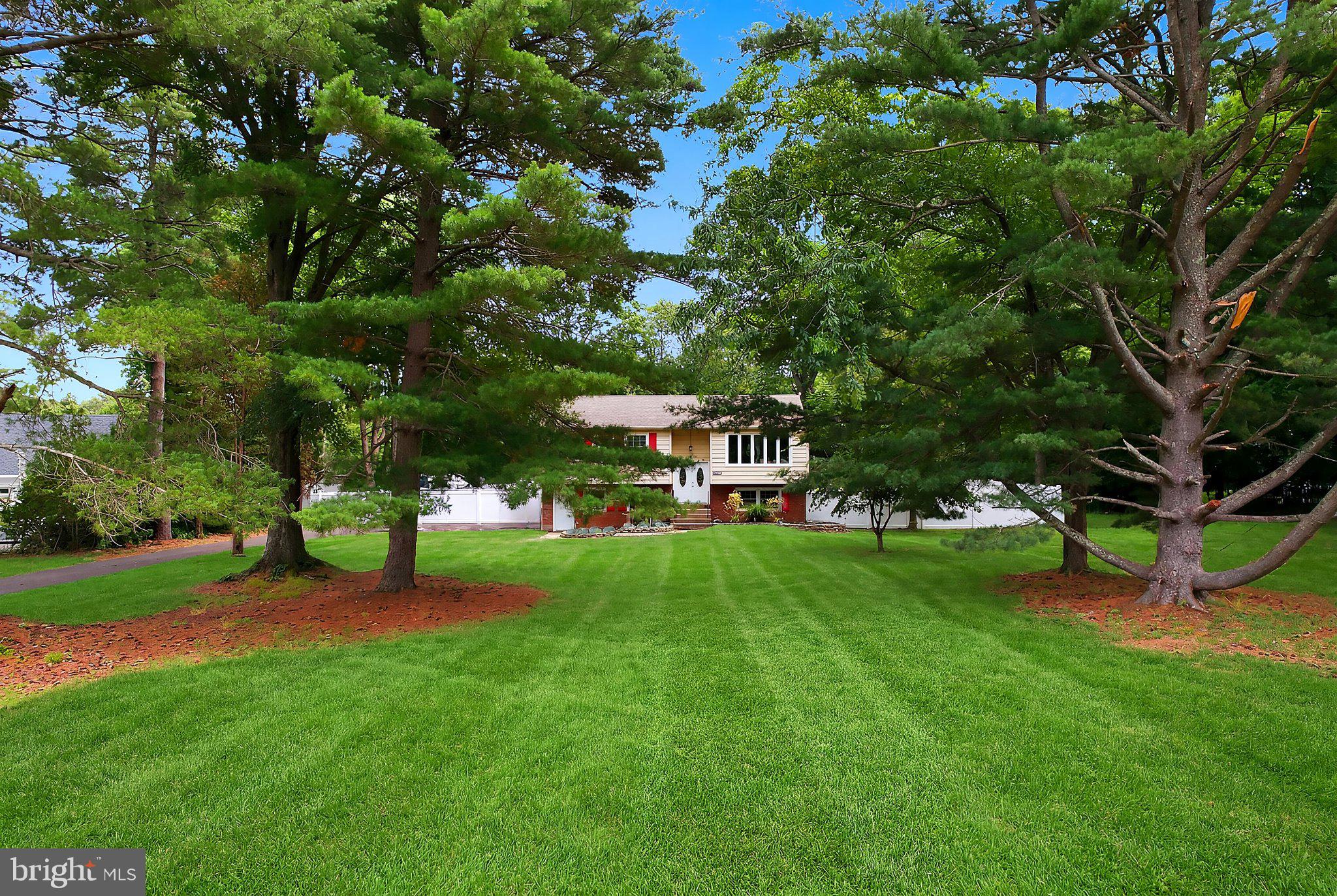 5017 Church Road Mount Laurel, NJ 08054 - Photo 4 of 37 Lush greenery surrounds a charming home.