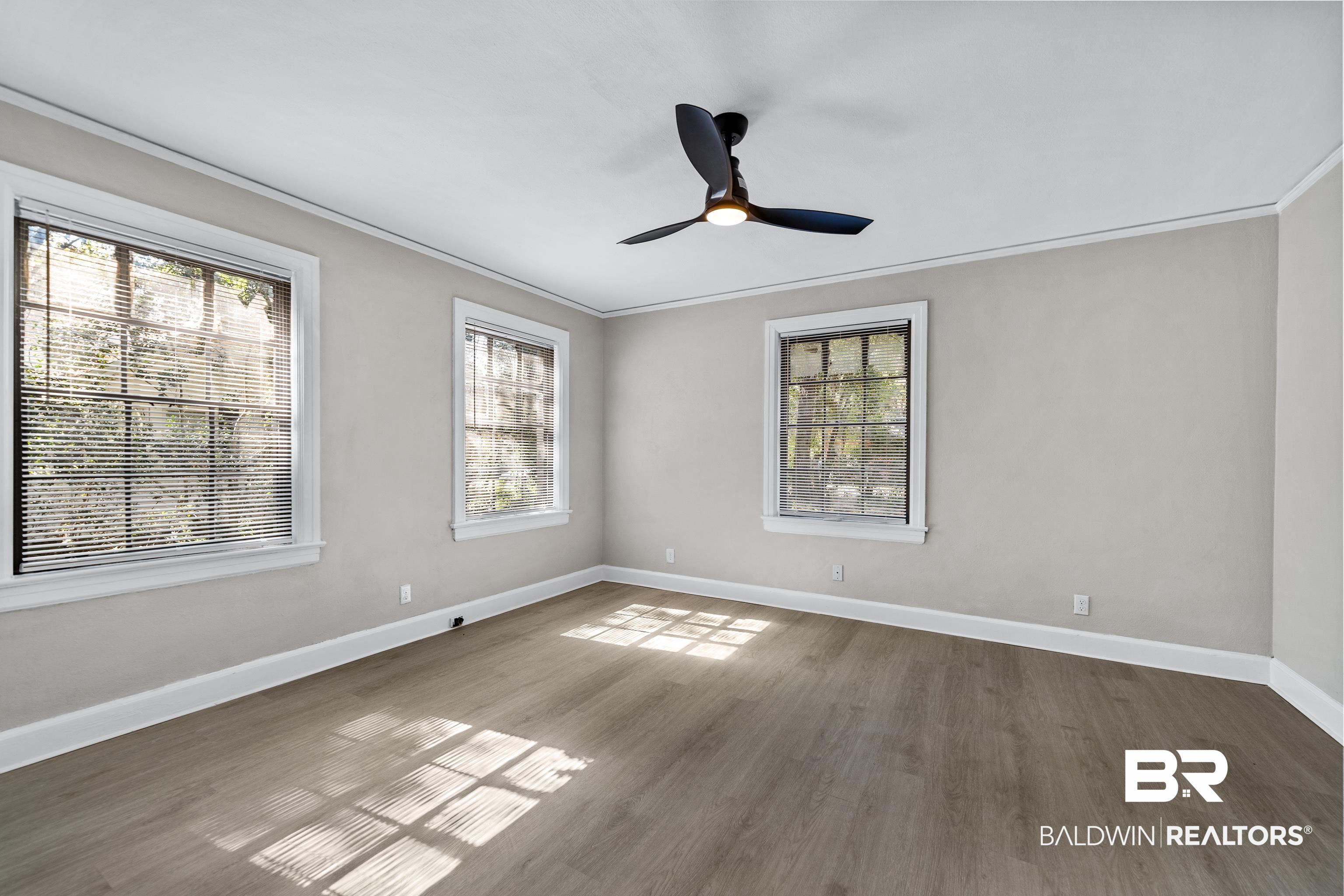611 Morgan Avenue Mobile, AL 36606 - Photo 19 of 24 Unfurnished room with ornamental molding, ceiling fan, and dark hardwood / wood-style flooring