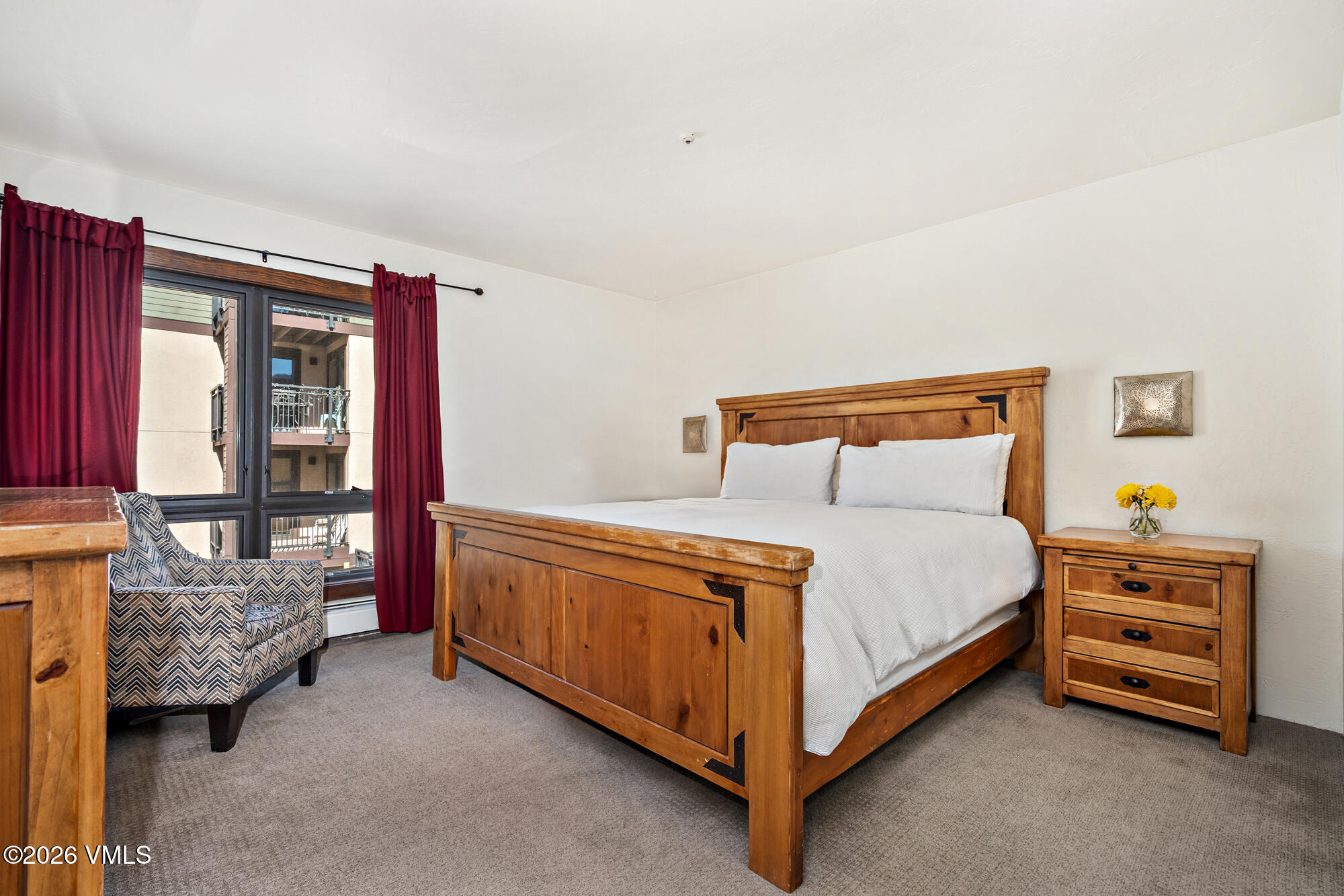 963 Lions Ridge Loop, Unit 502 Vail, CO 81657 - Photo 14 of 30 a bedroom with a bed and a window