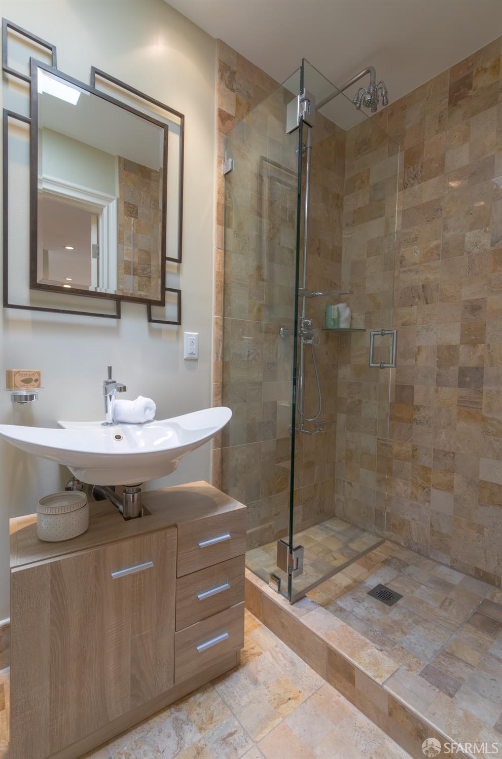 155 Upland Drive San Francisco, CA 94127 - Photo 12 of 43 a bathroom with a sink a mirror and a shower